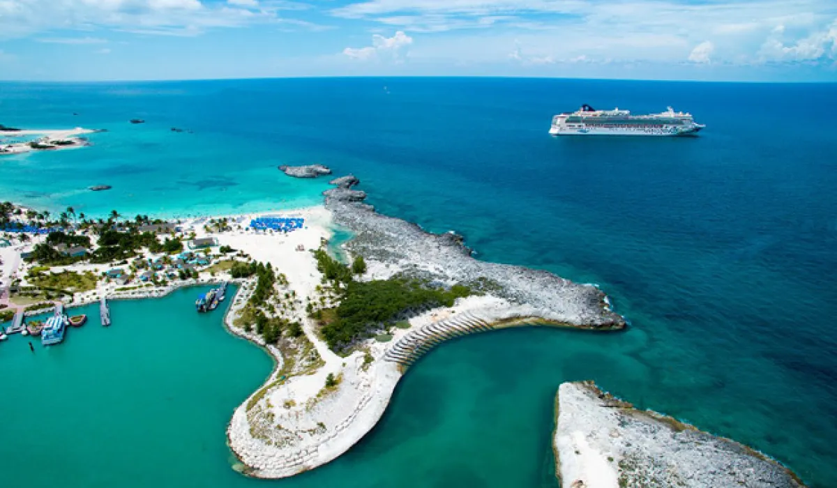 Aerial photograph of Great Stirrup Cay with turquoise water, white sand, and a cruise ship off the island